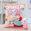 Snack Bag Plush Pillow with cute mini stuffed toys in soft pastel colors displayed on a table.