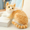 Soft cat plush toy with realistic design in orange and white, perfect for gifts and home décor.