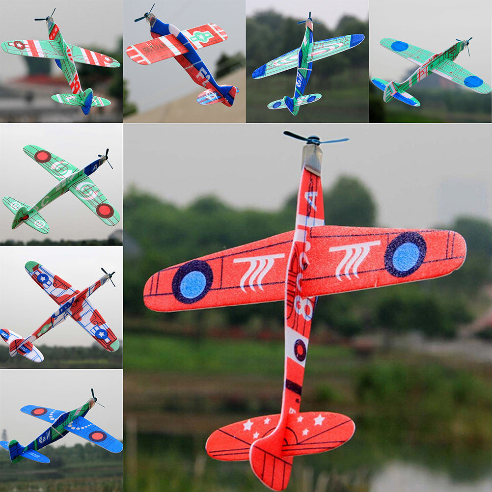 Colorful foam airplanes in flight, showcasing various designs and patterns against a blurred outdoor background.