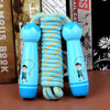 Wooden skipping rope for kids with blue cartoon handles, perfect for fun exercise and active play.