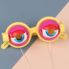 Funny crazy eyes glasses for kids, yellow and pink party favor toy with humorous design, perfect for pranks and costume events.