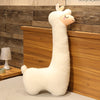 Large plush alpaca pillow on bed, perfect as a soft stuffed toy for sleeping or gifting.