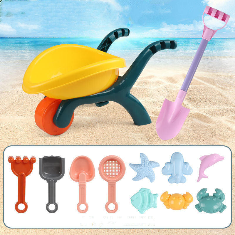 Kids beach toy set with colorful shovel, starfish molds, and sand tools for creative sand play on the beach.