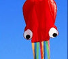 3D Octopus Kite in vibrant red with colorful tentacles against a clear blue sky.