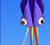 3D Octopus Kite with vibrant colors flying against a clear blue sky.