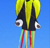 Colorful 3D octopus kite with long tails flying against a clear blue sky.