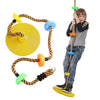 Child playing on a colorful climbing rope swing with platforms for backyard adventure and fun activities.