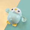 Cute wind-up swimming penguin bath toy with colorful design for babies, enhances motor skills and bath time fun.