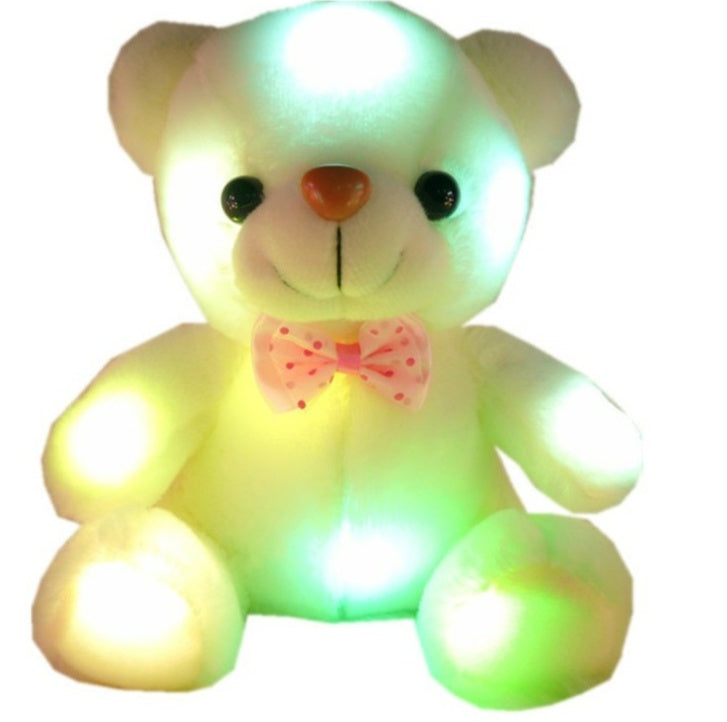 LED glowing teddy bear with colorful lights, soft plush fabric, and pink bow tie, perfect for bedtime cuddles and room decor.