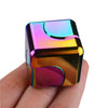 Colorful metal fidget spinner cube for stress relief and focus, held in hand.