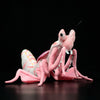 Lifelike pink mantis plush toy on a dark background, showcasing realistic insect design and vibrant colors.