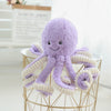 Purple octopus plush pendant with curly legs on a decorative stand, perfect for gifts and home décor.