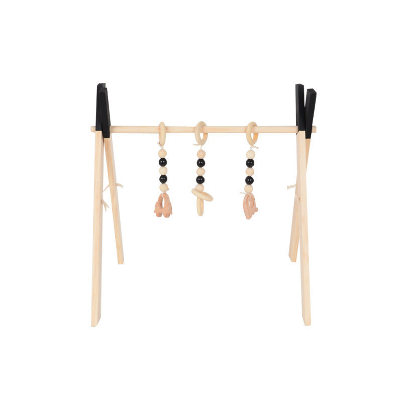 Wooden baby fitness frame with hanging toys for infant play and motor skill development.