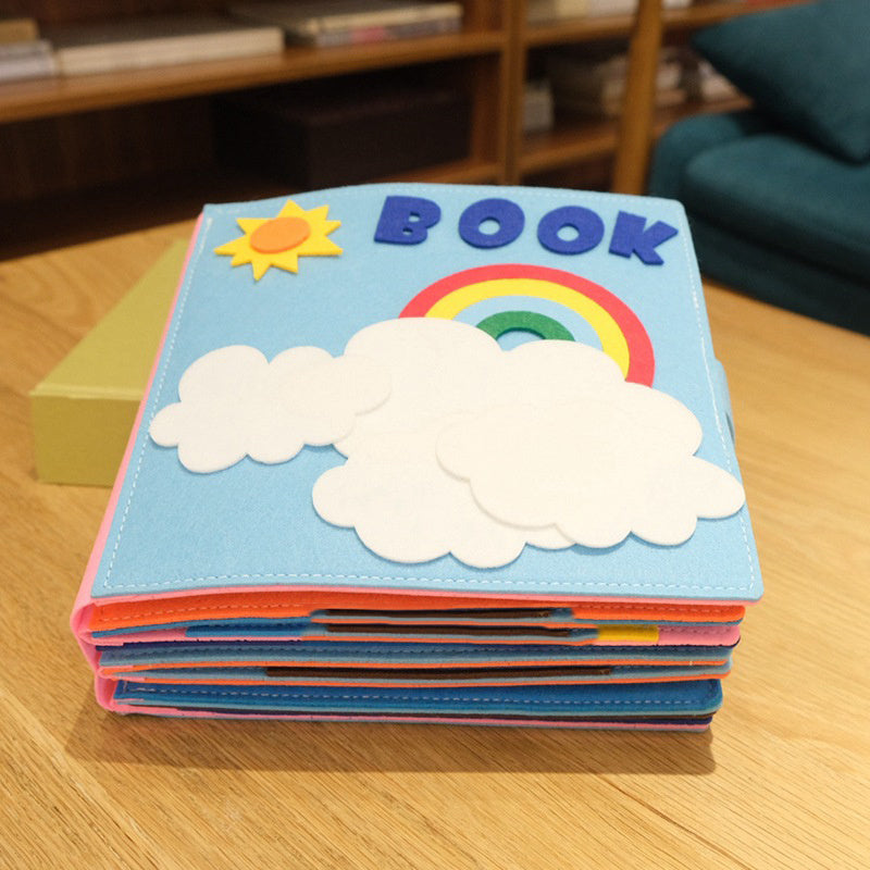 Montessori baby cloth book with colorful felt cover featuring clouds, rainbow, and sun, ideal for early learning and sensory play.