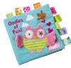 Soft baby cloth book with owl embroidery and colorful tabs, promoting sensory play and early learning.