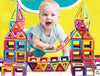 Baby playing with colorful magnetic building blocks set, promoting early learning and creativity with geometric shapes.