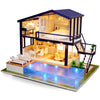 DIY 3D Wooden Dollhouse Kit with furniture, LED lights, and pool.