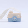 "Wooden toy camera for kids with pivotable lens, beige and blue design, eco-friendly and safe for pretend play and creativity."