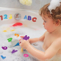 Child playing with foam letters and numbers in bathtub, colorful educational bath toy for kids.