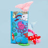 Baby cloth book toy with soft animal tails, featuring ocean theme and vibrant colors for sensory play and early learning.