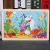 Colorful wooden animal puzzle for kids, featuring vibrant marine creatures, designed to enhance learning and motor skills.