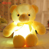 Luminous teddy bear plush toy glowing in the dark with soft plush fabric and yellow bow, perfect for children's bedtime comfort.