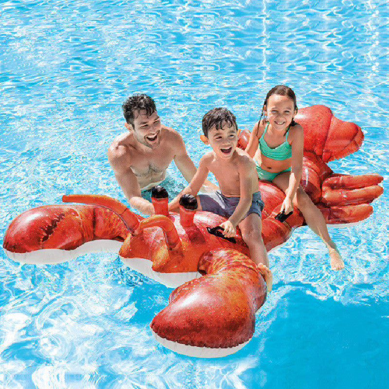 Family enjoying a fun ride on a giant inflatable lobster pool float with handles in a sparkling blue pool.