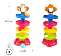 Colorful stackable rolling ball toy for babies with monkey topper, promoting motor skills and hand-eye coordination through play.