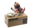 Robotic dog piggy bank eating coin on "Choken-Bako" box, interactive money-saving toy for kids and dog lovers.