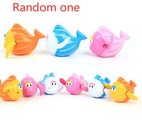 Colorful swimming bath toys for kids in orange, blue, and pink, ideal for fun water play and sensory development.