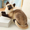 Soft cat plush toy on a couch, featuring a realistic design with brown and cream colors, perfect for gifts and home décor.