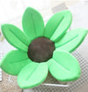 Soft green sunflower baby bath mat cushion with petals for cozy infant sink bath.