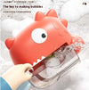 Cute red dinosaur bubble machine for baby baths, splashing water, creating bubbles, and entertaining in the bathtub.