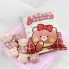 Snack Bag Plush Pillow with 8 Mini Plush Toys on Pink Blanket