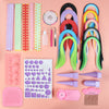 DIY quilling paper craft kit with colorful paper strips, shaping tools, and accessories for beginners and kids on pink background.