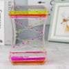 Creative quicksand liquid hourglass with pink and yellow fluid, modern desk and home décor ornament for office or living room.