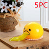 Funny Vomiting Egg Yolk Toy on a wooden table, ideal stress relief and prank gift, 5-pack option available.