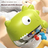 Green dinosaur-shaped bath bubble machine with musical features for babies.