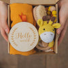 Baby Teething Toy Gift Set with gauze blanket, wooden milestone disc, and giraffe teether for sensory development.