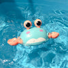 Cute crab-shaped clockwork bath toy floating in water, perfect for engaging kids during bath time with fun and interactive play.