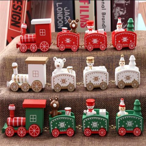 Mini wooden Christmas train set with red, white, and green festive designs on a display shelf. Perfect for holiday décor.