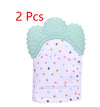 Baby teething glove with polka dots and green silicone top, 2-pack, designed to soothe teething discomfort.