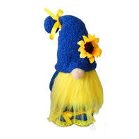 Bee-themed faceless doll with blue hat, sunflower accent, and long yellow legs, perfect for spring decor and gifting.