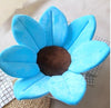 Soft blue sunflower baby bath mat with plush petals for infant sink bathing.