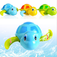 Colorful swimming tortoise bath toys for kids in blue, yellow, and green with wind-up design for fun water play.