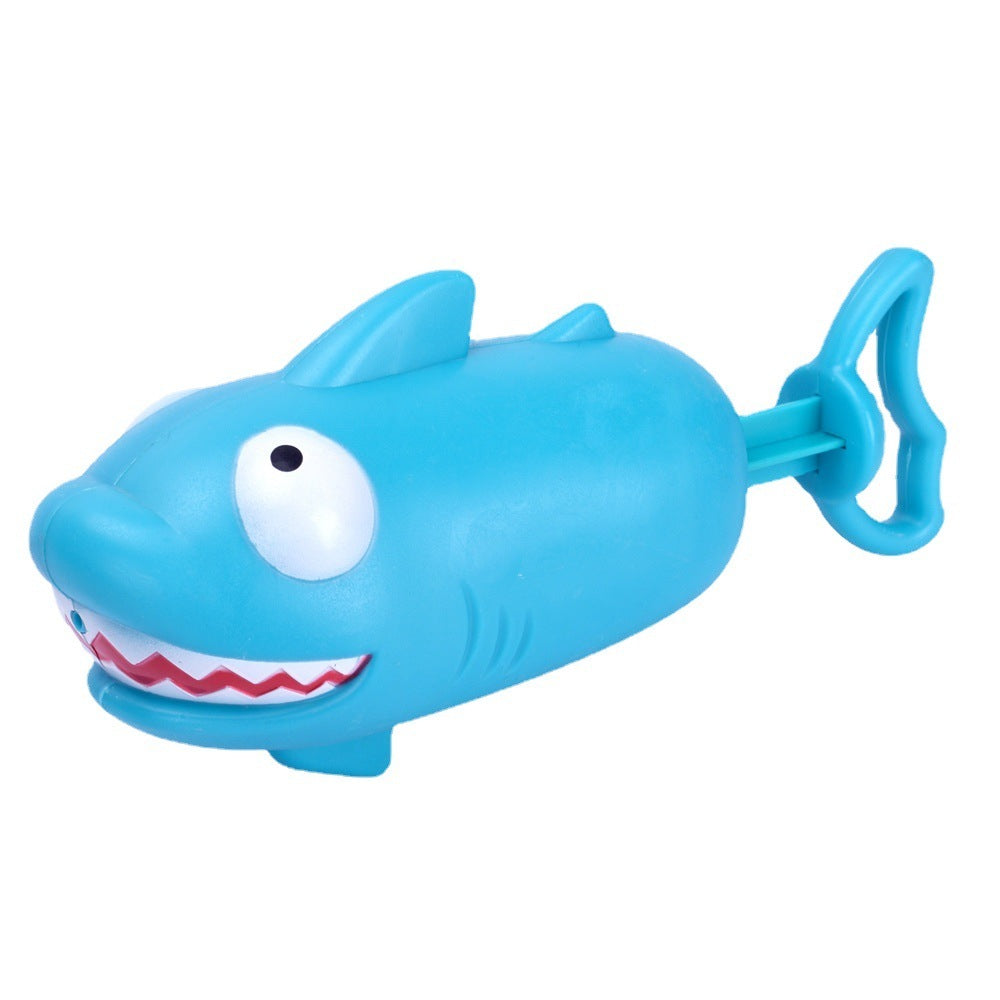 Blue shark-shaped water toy with handle for kids' bath and beach fun.