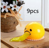 Funny vomiting egg yolk toy with yellow slime, stress relief squishy prank gift on a wooden tray, 9 pieces in set.