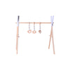 Wooden baby fitness frame with polished finish, featuring hanging toys for infant play and development in a nursery setting.