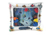 Baby inflatable water play mat with ocean theme, colorful floating shapes, and sensory textures for tummy time fun.