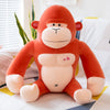 Plush orangutan toy with red and white coloration on a bed, featuring ultra-soft stretch velvet fabric and love heart accents.